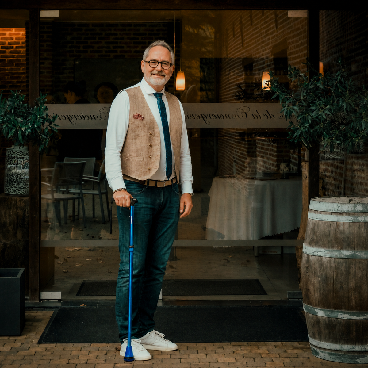 Man standing upright with a properly fitted walking cane